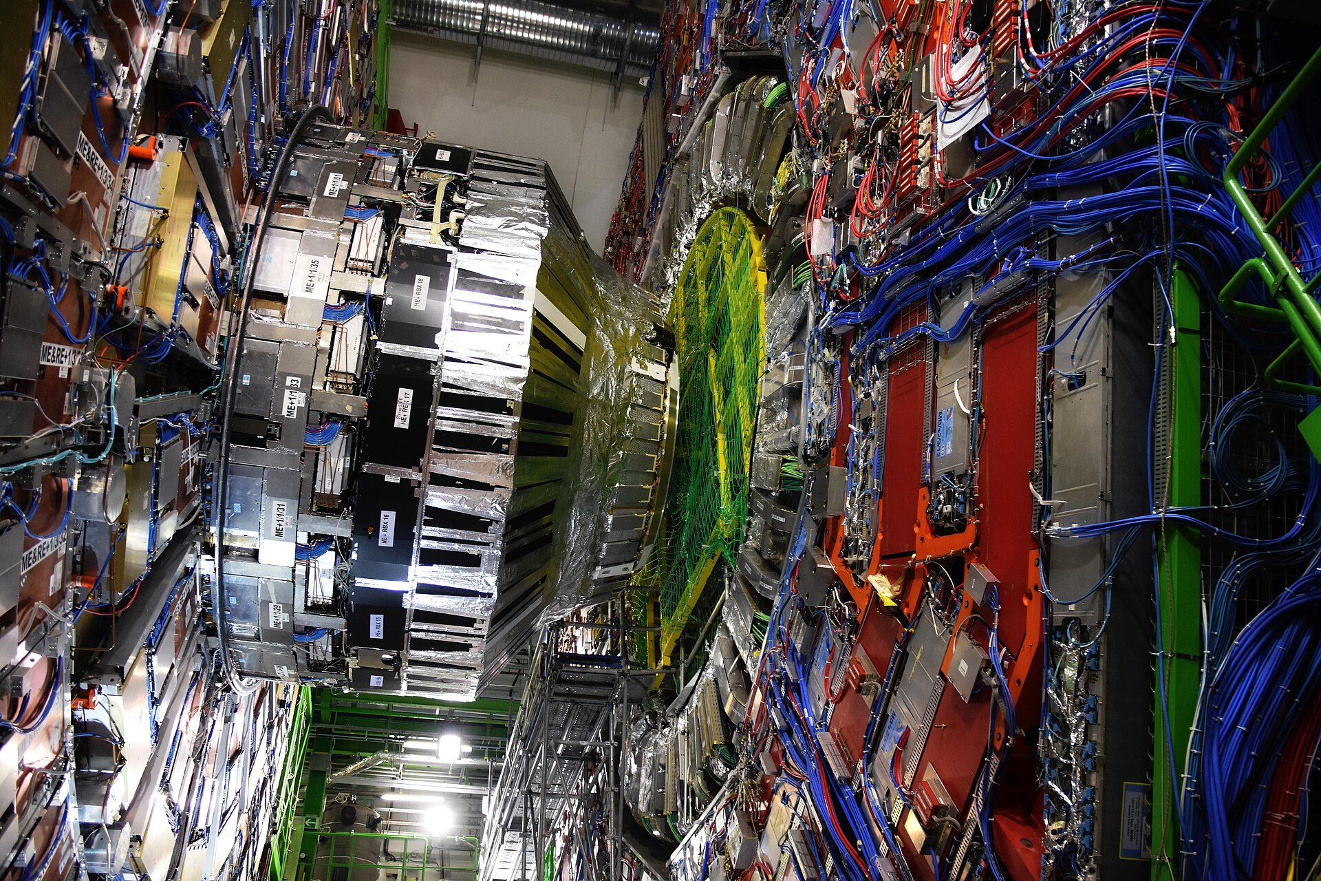 The layered red and silver Compact Muon Solenoid detector at CERN.
