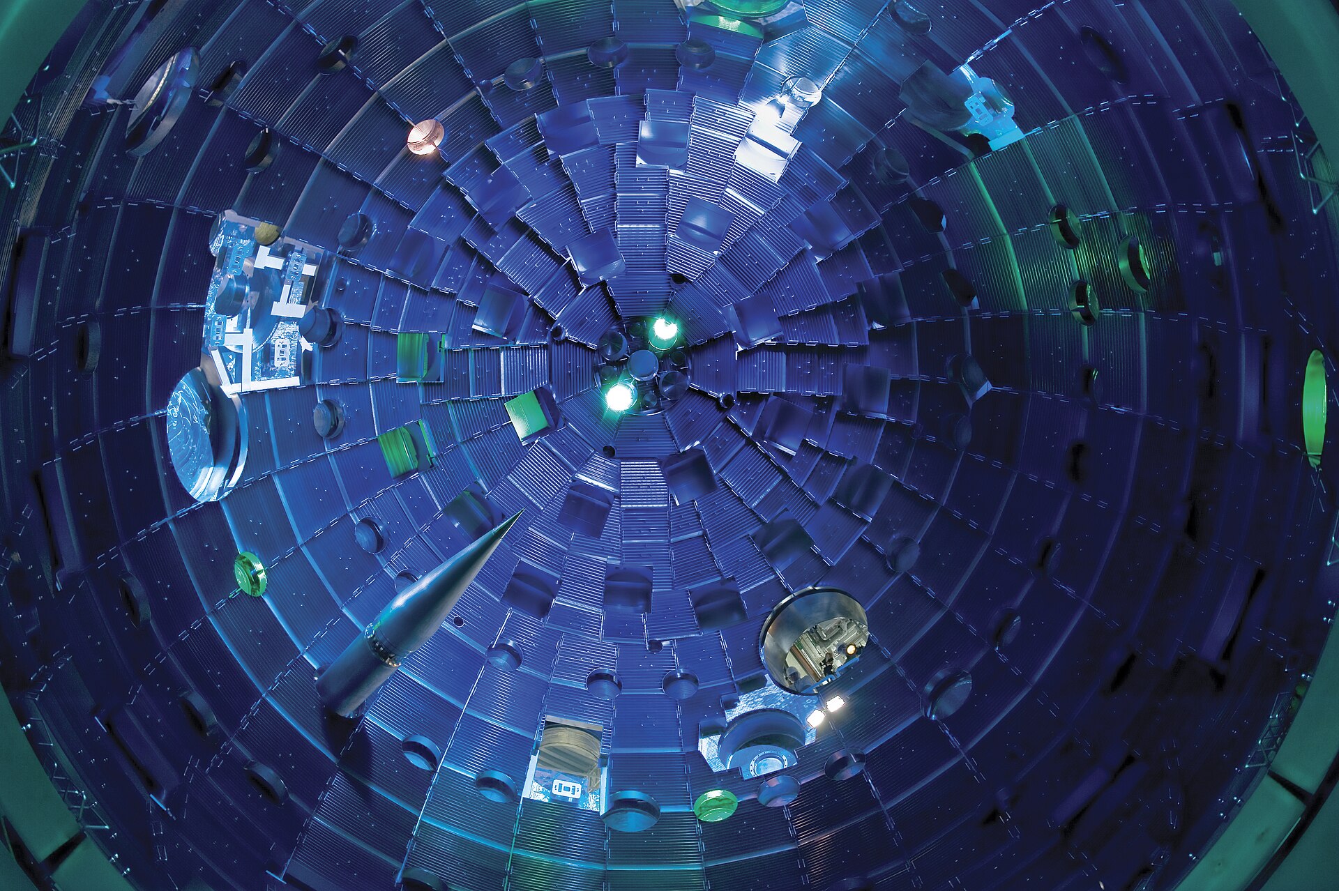 A wide-angle view from inside the spherical National Ignition Facility target chamber with the target positioner being inserted.